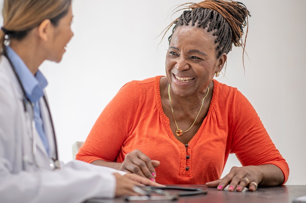 Woman talking with female doctor