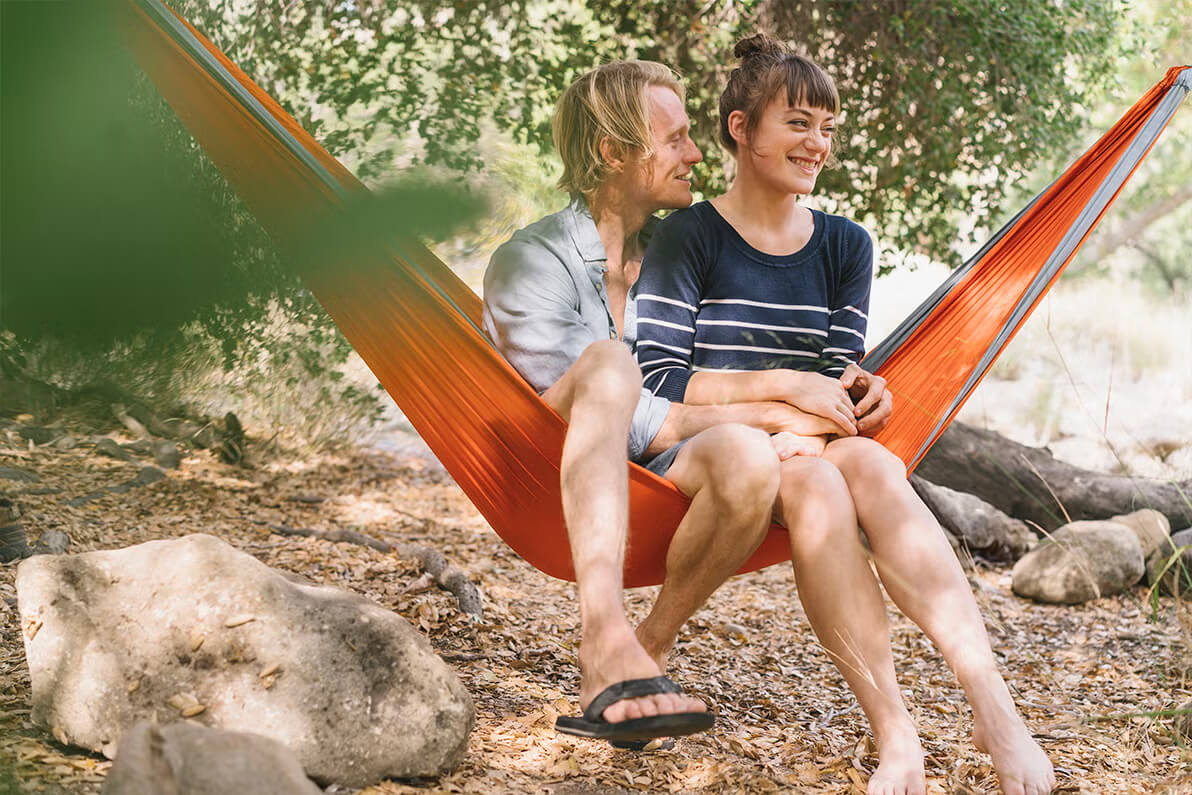 A happy couple camping.